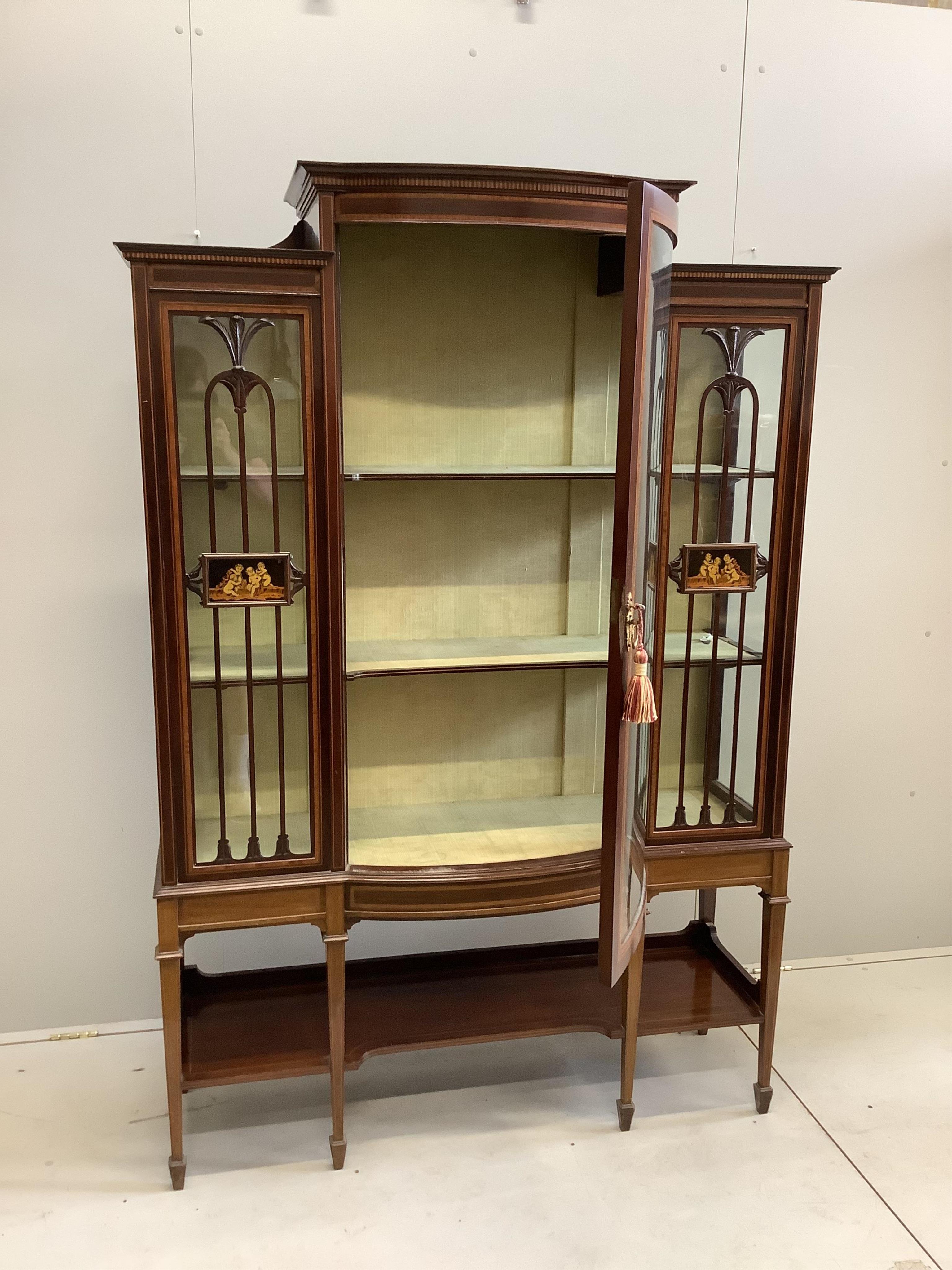 An Edwardian inlaid and satinwood crossbanded mahogany bow front display cabinet, width 126cm, depth 42cm, height 185cm. Condition - good